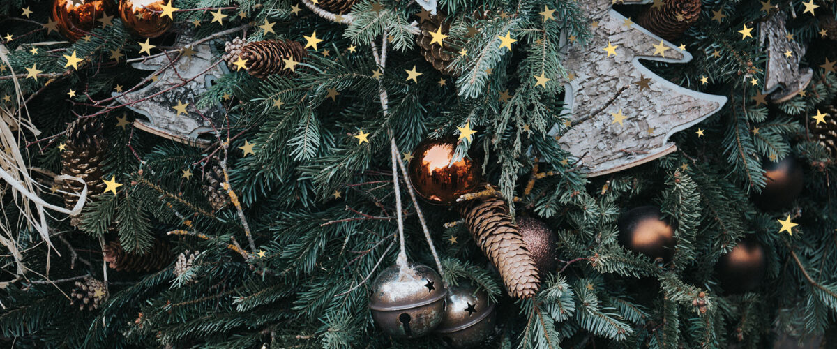 A beautiful shot of Christmas ornaments on a tree - perfect for a winter wallpaper